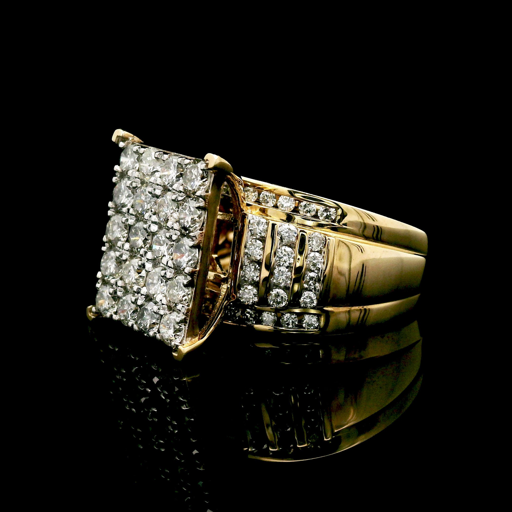 Gold ring with diamond square cluster on a black background side